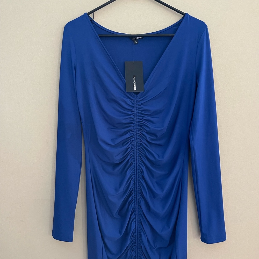 Blue dress, long sleeve. Stretch material